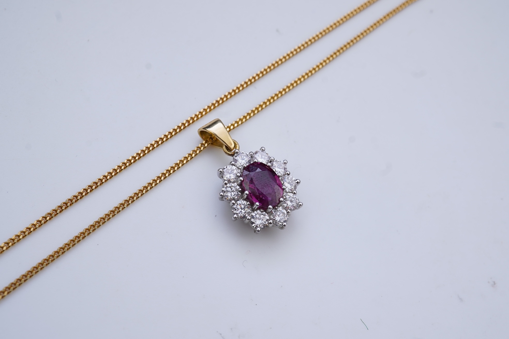 A ruby and diamond pendant